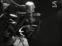 On-board radiotelegraphist using the radiogoniometer. Taken from the film Luce.